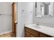 This bathroom has a wood cabinet vanity, a rectangular mirror, and a built-in wood cabinet at 10602 Fall Rd, Fishers, IN 46037