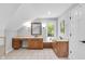 Bright bathroom featuring custom vanity, tile floors, mirror, and lighting at 10602 Fall Rd, Fishers, IN 46037