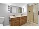Bathroom boasts a double sink vanity with an enclosed shower and toilet at 10602 Fall Rd, Fishers, IN 46037