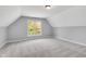 This bedroom features neutral walls, large window, and soft carpeting at 10602 Fall Rd, Fishers, IN 46037