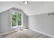 Bedroom features a neutral color scheme, a large window, and soft carpeting at 10602 Fall Rd, Fishers, IN 46037