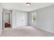Neutral bedroom with double closets and a window at 10602 Fall Rd, Fishers, IN 46037