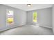 Cozy bedroom offering neutral carpet, two windows, and plenty of natural light at 10602 Fall Rd, Fishers, IN 46037
