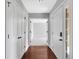 Bright foyer featuring hardwood floors and white doors at 10602 Fall Rd, Fishers, IN 46037