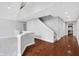 Upper hallway featuring hardwood floors and stairway at 10602 Fall Rd, Fishers, IN 46037