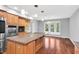 This kitchen offers an island, wood cabinetry, and stainless steel appliances at 10602 Fall Rd, Fishers, IN 46037