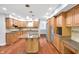 Spacious kitchen features wood cabinets, stainless appliances, and granite countertops at 10602 Fall Rd, Fishers, IN 46037