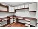 Office with white cabinets and built-in wood desk and drawers at 10602 Fall Rd, Fishers, IN 46037