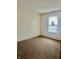 This bedroom has neutral walls and carpet, a window with blinds, and electrical outlets at 1081 Torino Ln, Franklin, IN 46131