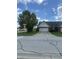 View of a single-story home's exterior elevation and a concrete driveway at 1081 Torino Ln, Franklin, IN 46131