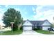 Charming home featuring a two-car garage and well-maintained front yard with a beautiful tree at 1081 Torino Ln, Franklin, IN 46131