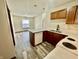 Open kitchen layout with white appliances, white counter and ample cabinet space, bright and functional at 1081 Torino Ln, Franklin, IN 46131