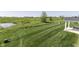 Expansive backyard featuring a pond and mature trees providing a serene outdoor space at 1115 Senate Dr, Edinburgh, IN 46124