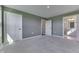 Neutral bedroom featuring plush carpet, two white doors, and access to an ensuite bathroom at 1115 Senate Dr, Edinburgh, IN 46124