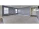 Spacious bedroom featuring plush carpeting, recessed lighting, and neutral gray walls at 1115 Senate Dr, Edinburgh, IN 46124