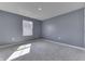 Bedroom featuring gray walls, carpet floors, and a single window at 1115 Senate Dr, Edinburgh, IN 46124