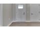 Bright entryway featuring light gray walls, wood-look floors and a door with window at 1115 Senate Dr, Edinburgh, IN 46124