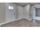 Bright entryway featuring light gray walls, wood-look floors and white doors at 1115 Senate Dr, Edinburgh, IN 46124