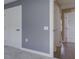 Hallway featuring wood floors and white trim doors and casings at 1115 Senate Dr, Edinburgh, IN 46124