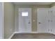 Hallway with hardwood flooring, white trim and doors, with easy access to the home's other areas at 1115 Senate Dr, Edinburgh, IN 46124