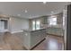 Open kitchen with granite island, stainless steel appliances and ample cabinet space, perfect for cooking and entertaining at 1115 Senate Dr, Edinburgh, IN 46124