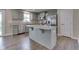 Bright kitchen features stainless steel appliances, granite countertops, and a large kitchen island at 1115 Senate Dr, Edinburgh, IN 46124