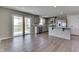 Open-concept kitchen featuring gray cabinetry, stainless appliances and sliding glass door at 1115 Senate Dr, Edinburgh, IN 46124