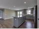 Open kitchen featuring a central island with granite countertops and stainless steel appliances at 1115 Senate Dr, Edinburgh, IN 46124