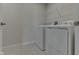 Laundry room with white washer and dryer hookups and wire shelving at 1115 Senate Dr, Edinburgh, IN 46124