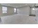 Spacious living room featuring neutral carpet, tv mount and large windows at 1115 Senate Dr, Edinburgh, IN 46124