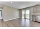 Open-concept living space with vinyl plank flooring and an adjoining kitchen at 1115 Senate Dr, Edinburgh, IN 46124