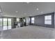 Open concept living room and kitchen with modern stainless appliances and lots of natural light at 1115 Senate Dr, Edinburgh, IN 46124