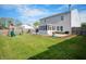 Large backyard features a play set and outdoor shed at 1257 Rosemary Ct, Greenfield, IN 46140