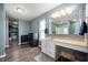 Bathroom featuring modern sink vanity, framed mirror, and a large walk-in closet at 1257 Rosemary Ct, Greenfield, IN 46140