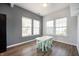 Bright breakfast nook with natural light from three large windows and table at 1257 Rosemary Ct, Greenfield, IN 46140