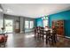 Bright dining area with hardwood floors, large windows, built-in bench, and stylish decor at 1257 Rosemary Ct, Greenfield, IN 46140
