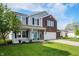 Well-maintained two-story home with blue shutters and a manicured lawn on a sunny day at 1257 Rosemary Ct, Greenfield, IN 46140