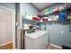 Functional laundry room with modern washer and dryer and ample storage space at 1257 Rosemary Ct, Greenfield, IN 46140