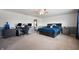 A spacious main bedroom with dark wood furniture and blue bedding at 1257 Rosemary Ct, Greenfield, IN 46140