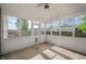 Bright screened-in porch perfect for enjoying the outdoors with protection from insects at 1257 Rosemary Ct, Greenfield, IN 46140