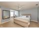 Bedroom with accent mirror, beige furniture and ceiling fan at 1274 Old Heritage Pl, Greenwood, IN 46143
