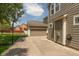 Exterior view featuring a garage, driveway, basketball hoop, and a well-maintained lawn at 1274 Old Heritage Pl, Greenwood, IN 46143