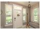Welcoming entryway with a decorative wreath on the front door and ample natural light from surrounding windows at 1274 Old Heritage Pl, Greenwood, IN 46143