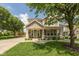 Charming two-story home with a covered porch and well-manicured lawn, perfect for Gathering living at 1274 Old Heritage Pl, Greenwood, IN 46143