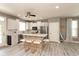 Beautiful, open kitchen with a large island, stainless steel appliances, gray walls, and modern lighting at 1274 Old Heritage Pl, Greenwood, IN 46143
