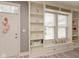 Cozy living space featuring a built in bench, shelving, and front door access at 1274 Old Heritage Pl, Greenwood, IN 46143