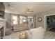 Inviting living room with a stone fireplace, gray sofas, and an open floor plan, perfect for modern living and entertaining at 1274 Old Heritage Pl, Greenwood, IN 46143