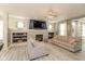 Comfortable living room with a stone fireplace, a large TV, and neutral decor, ideal for relaxing and entertaining guests at 1274 Old Heritage Pl, Greenwood, IN 46143