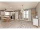 Open concept living and kitchen area with hardwood floors and modern chandelier at 1274 Old Heritage Pl, Greenwood, IN 46143