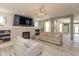 Spacious living room featuring a stone fireplace, built-in shelves, and stylish gray sofas for comfortable living at 1274 Old Heritage Pl, Greenwood, IN 46143
